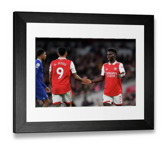 Framed Print : Arsenal's Gabriel Jesus and Bukayo Saka Share a Moment Amidst the Intensity of the Arsenal v Chelsea Rivalry (2022-23)