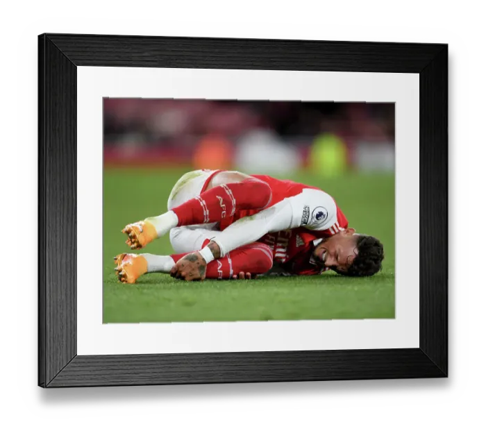 Framed Print : Arsenal vs. Chelsea: Intense Moment as Ben White Clutches His Face in Premier League Showdown, London 2023