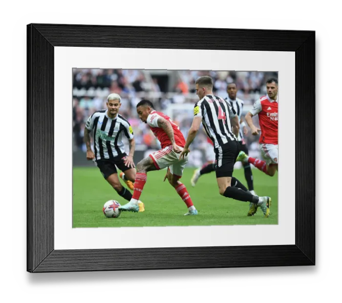 Framed Print : Gabriel Jesus vs Sven Botman: Intense Battle in Newcastle United vs Arsenal FC Premier League Clash
