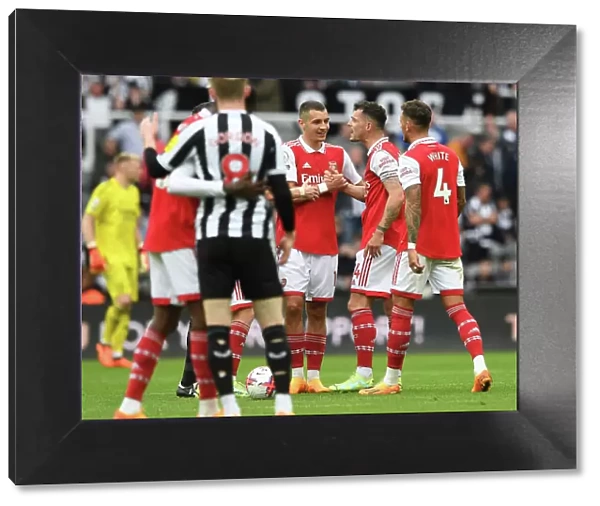 Arsenal's Granit Xhaka and Jakub Kiwior Celebrate Victory Over Newcastle United in Premier League Clash