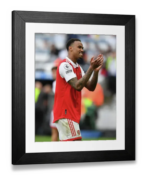 Framed Print : Arsenal's Gabriel Magalhaes Celebrates with Fans after Newcastle Victory, Premier League 2022-23