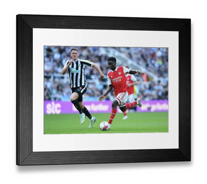 Framed Print : Bukayo Saka vs Newcastle: Intense Battle at St. James Park - Arsenal vs Newcastle United, Premier League 2022-23 Framed Print : Bukayo Saka vs Newcastle: Intense Battle at St. James Park - Arsenal vs Newcastle United, Premier League 2022-23