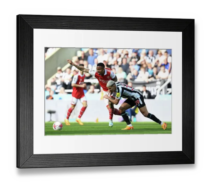 Framed Print : Gabriel Jesus vs Bruno Guimaraes: Intense Battle in Newcastle United vs Arsenal FC Premier League Clash