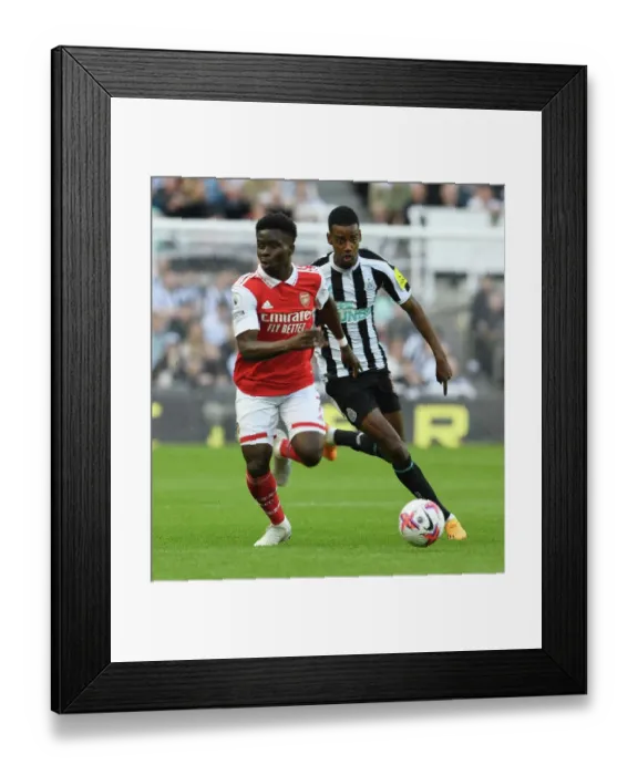 Framed Print : Bukayo Saka vs. Alexander Isak: Intense Battle at St. James Park - Arsenal vs. Newcastle United, Premier League 2022-23 Framed Print : Bukayo Saka vs. Alexander Isak: Intense Battle at St. James Park - Arsenal vs. Newcastle United, Premier League 2022-23