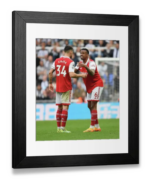 Framed Print : Arsenal's Xhaka and Gabriel Face Off Against Newcastle United in Premier League Clash (2022-23)