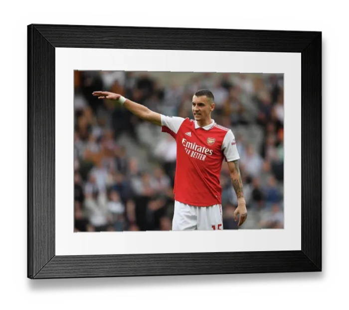 Framed Print : Arsenal's Jakub Kiwior Goes Head-to-Head with Newcastle United in Premier League Battle (2022-2023)
