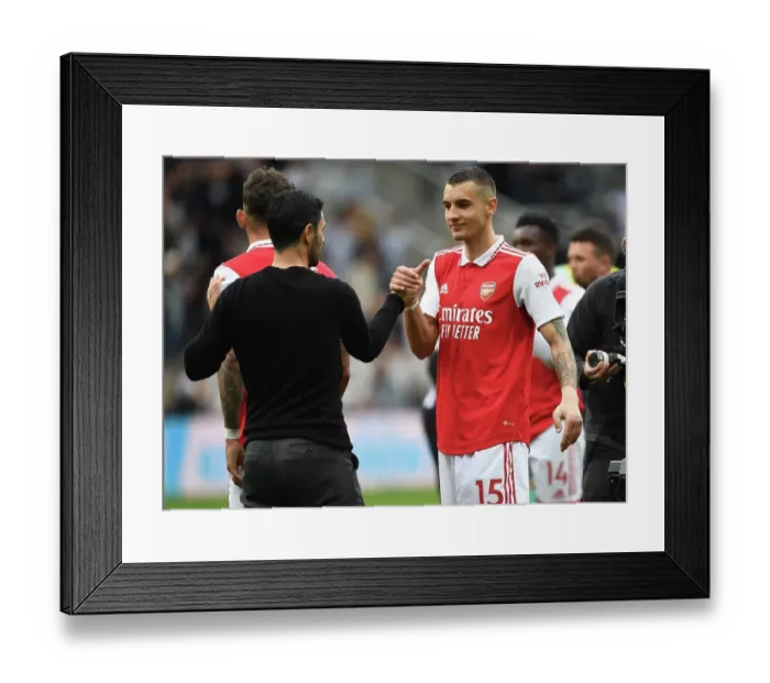 Framed Print : Arsenal's Victory at Newcastle: Mikel Arteta Congratulates Jakub Kiwior Framed Print : Arsenal's Victory at Newcastle: Mikel Arteta Congratulates Jakub Kiwior