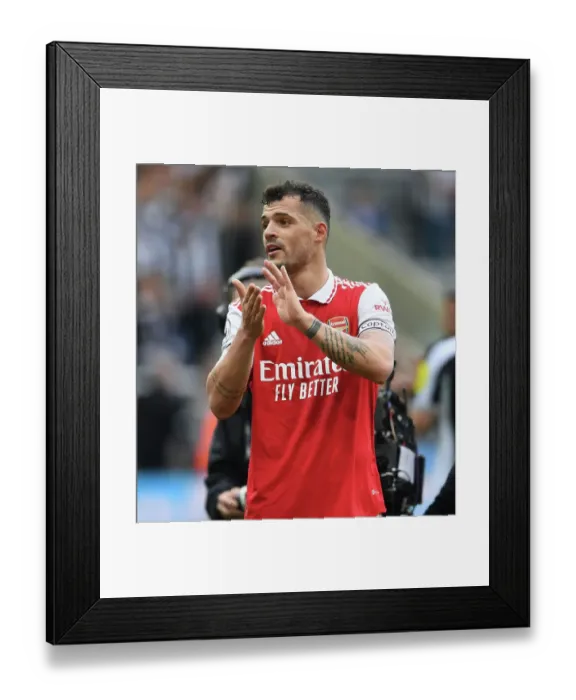Framed Print : Granit Xhaka's Heartfelt Applause: Arsenal's Victory at Newcastle United (2022-23) Framed Print : Granit Xhaka's Heartfelt Applause: Arsenal's Victory at Newcastle United (2022-23)