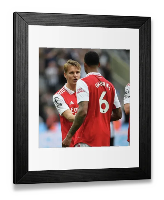 Framed Print : Arsenal's Martin Odegaard and Gabriel Face Off Against Newcastle United in Premier League Showdown (2022-23) Framed Print : Arsenal's Martin Odegaard and Gabriel Face Off Against Newcastle United in Premier League Showdown (2022-23)