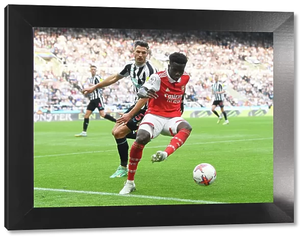 Bukayo Saka Faces Off Against Fabian Schaer: Intense Battle at St. James Park - Arsenal vs Newcastle United, Premier League 2022-23