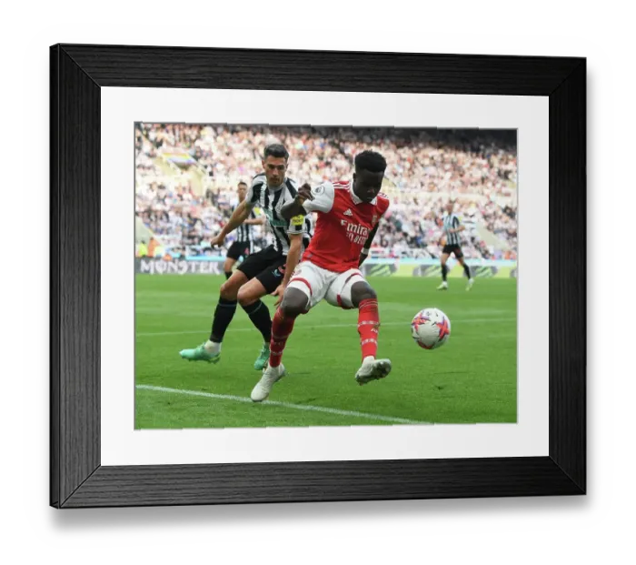Framed Print : Saka's Unyielding Spirit: Arsenal's Triumph Over Newcastle United, Premier League 2022-23 Framed Print : Saka's Unyielding Spirit: Arsenal's Triumph Over Newcastle United, Premier League 2022-23