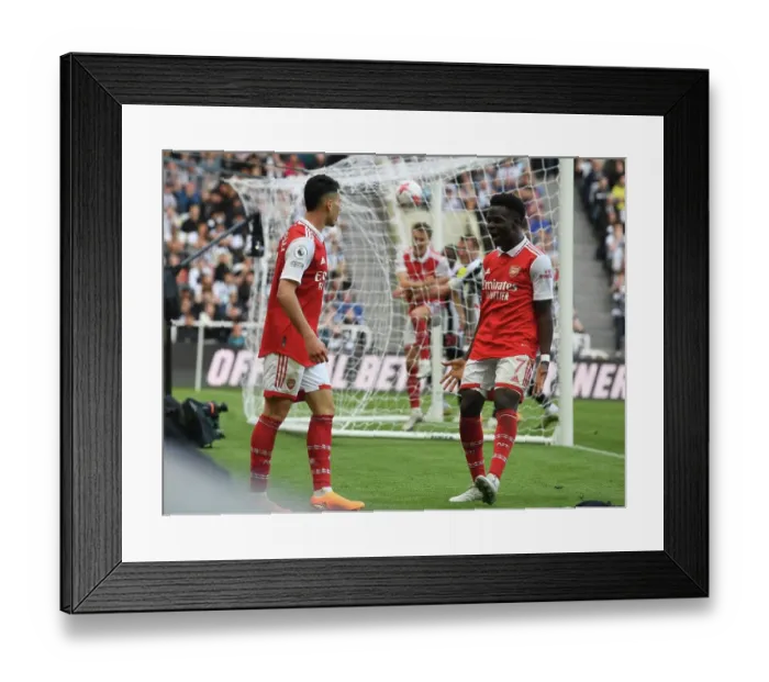 Framed Print : Martinelli and Saka Celebrate Arsenal's Winning Goals Against Newcastle United (2022-23)