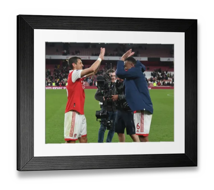 Framed Print : Arsenal Defenders Celebrate Victory Over Chelsea in Premier League Showdown