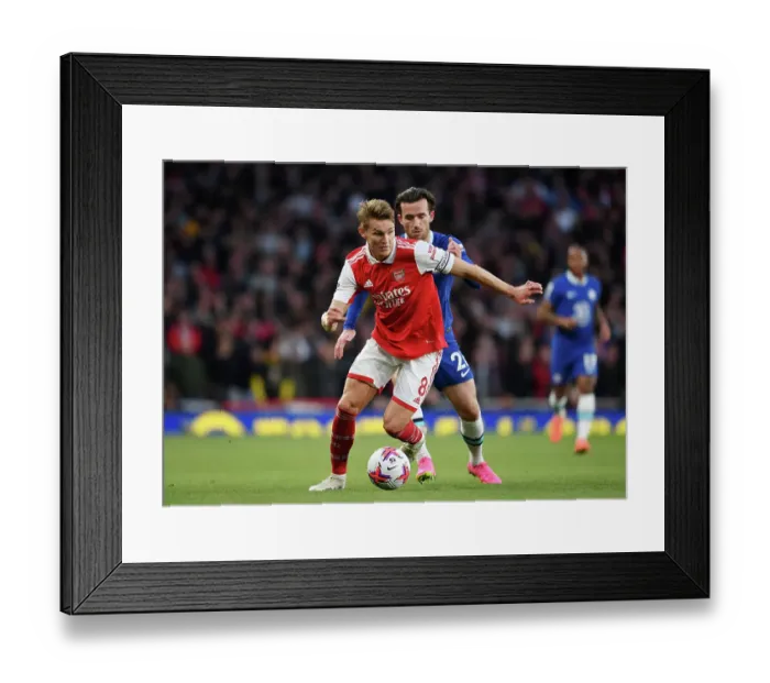 Framed Print : Arsenal's Martin Odegaard Faces Off Against Chelsea's Ben Chilwell in Intense Premier League Clash Framed Print : Arsenal's Martin Odegaard Faces Off Against Chelsea's Ben Chilwell in Intense Premier League Clash