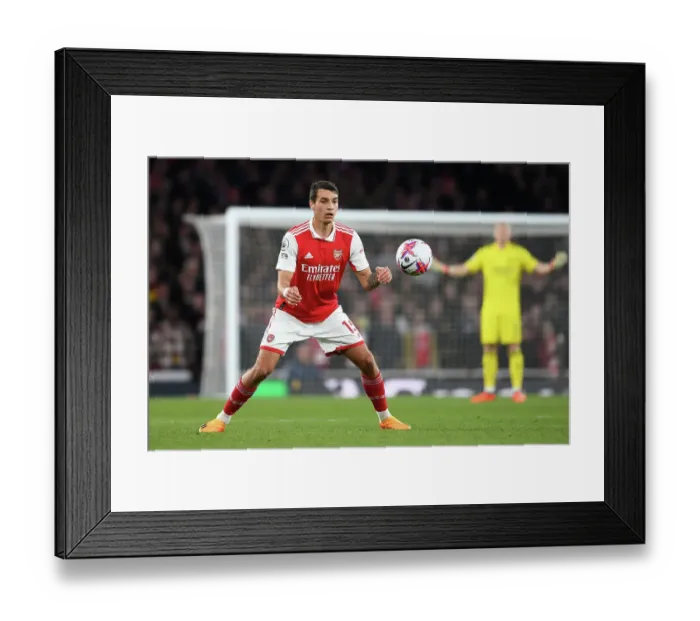 Framed Print : Arsenal vs. Chelsea: Intense Rivalry in the Premier League - Jakub Kiwior's Focus at Emirates Stadium (2022-23)