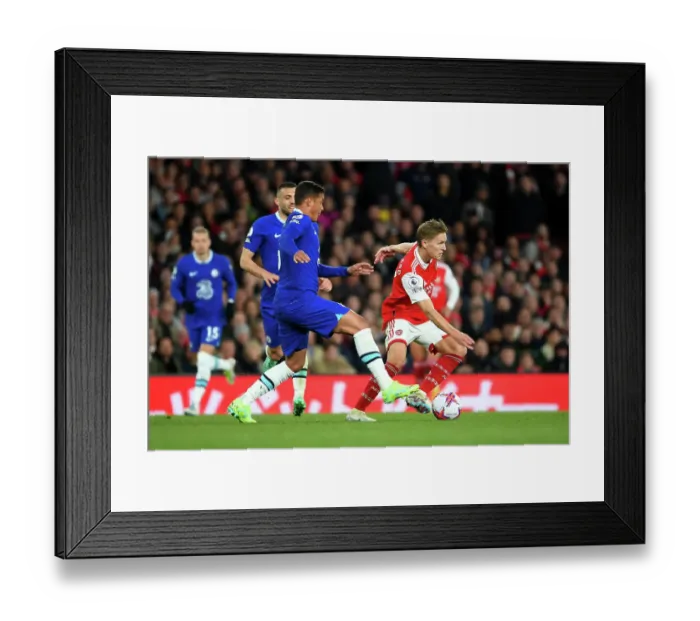 Framed Print : Arsenal's Martin Odegaard Faces Off Against Chelsea's Thiago Silva in Intense Premier League Clash Framed Print : Arsenal's Martin Odegaard Faces Off Against Chelsea's Thiago Silva in Intense Premier League Clash