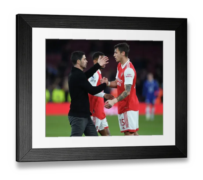 Framed Print : Arsenal's Victory: Mikel Arteta Embraces Jakob Kiwior After Arsenal v Chelsea Match, Premier League 2022-23