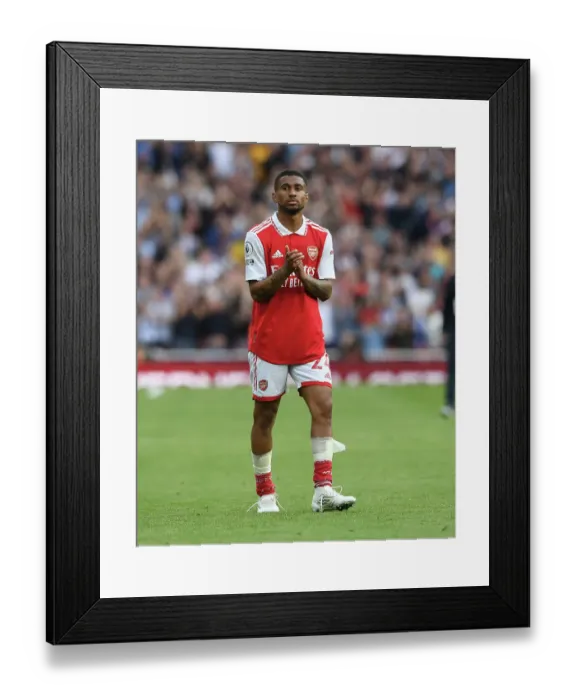 Framed Print : Arsenal's Reiss Nelson Celebrates with Fans after Arsenal v Brighton & Hove Albion Win, Premier League 2022-23