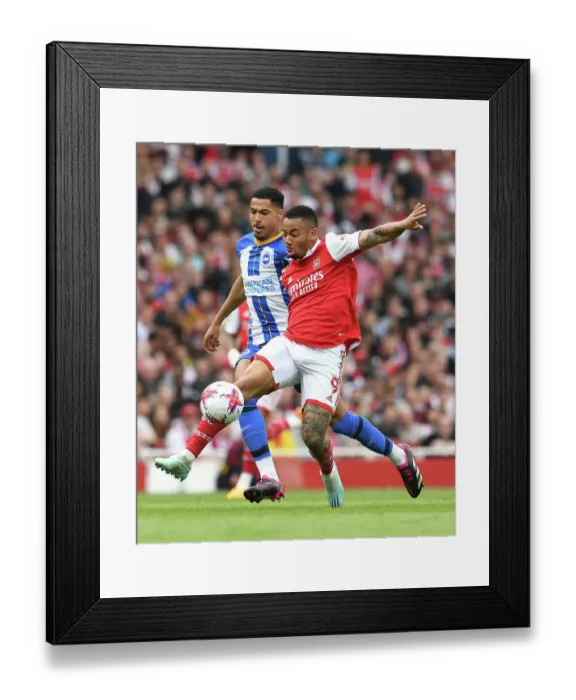 Framed Print : Arsenal's Gabriel Jesus Faces Off Against Brighton's Levi Colwill in Intense Premier League Clash