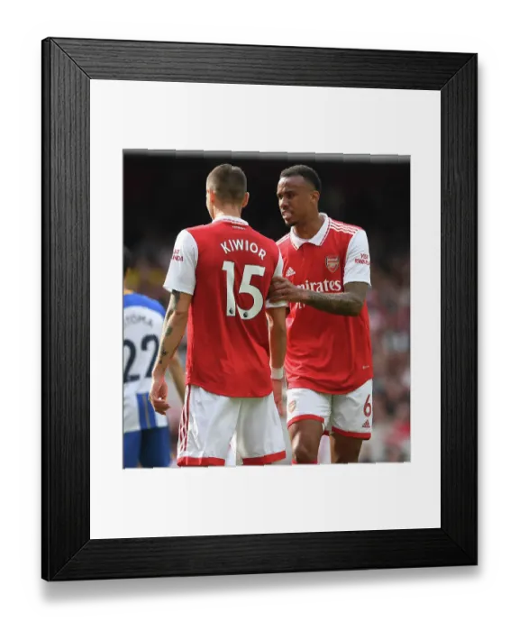 Framed Print : Arsenal's Magalhaes and Kiwior in Action against Brighton in 2022-23 Premier League