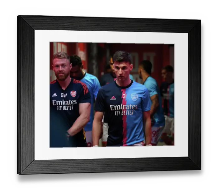 Framed Print : Arsenal's Kieran Tierney Gears Up for Arsenal v Brighton & Hove Albion (2022-23)