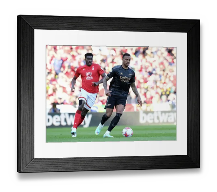 Framed Print : Gabriel vs Awoniyi: Intense Battle at Nottingham Forest vs Arsenal FC, Premier League 2022-23