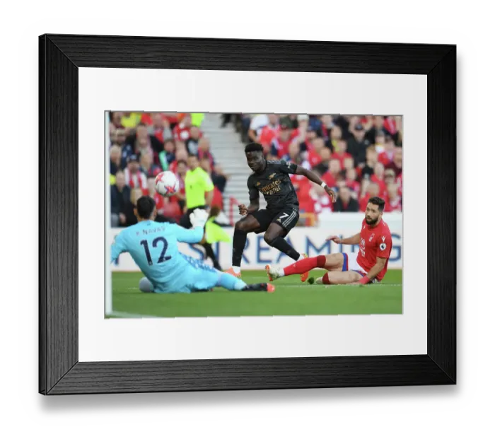 Framed Print : Bukayo Saka Takes Aim: Nottingham Forest vs. Arsenal FC, Premier League 2022-23