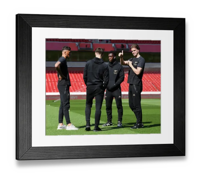 Framed Print : Arsenal's Rob Holding Examines Nottingham Forest's Premier League Pitch Before Showdown (2022-23)