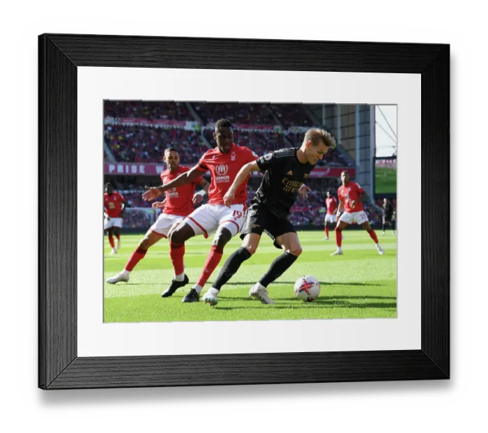 Framed Print : Clash at the City Ground: Arsenal's Martin Odegaard Faces Off Against Nottingham Forest's Moussa Niakhate