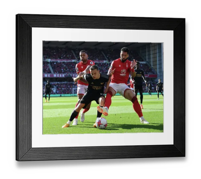 Framed Print : Arsenal's Trossard Faces Off Against Forest's Lodi and Felipe in Intense Premier League Clash