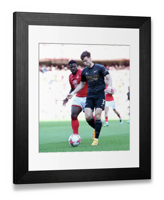 Framed Print : Arsenal's Kieran Tierney vs. Nottingham Forest's Serge Aurier: A Premier League Battle Framed Print : Arsenal's Kieran Tierney vs. Nottingham Forest's Serge Aurier: A Premier League Battle