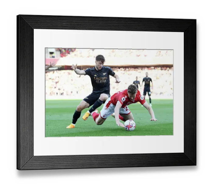 Framed Print : Arsenal's Kieran Tierney Fights for Possession Against Nottingham Forest in Premier League Clash Framed Print : Arsenal's Kieran Tierney Fights for Possession Against Nottingham Forest in Premier League Clash