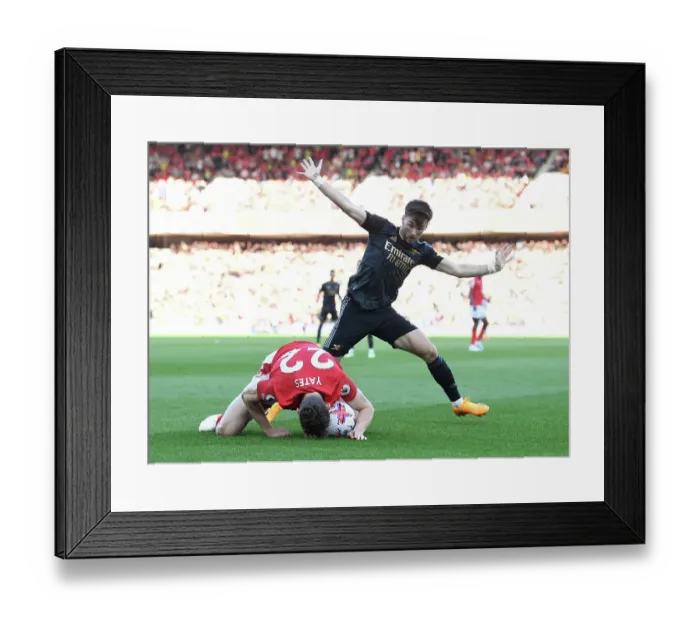 Framed Print : Arsenal's Kieran Tierney Faces Off Against Nottingham Forest's Ryan Yates in Premier League Clash Framed Print : Arsenal's Kieran Tierney Faces Off Against Nottingham Forest's Ryan Yates in Premier League Clash