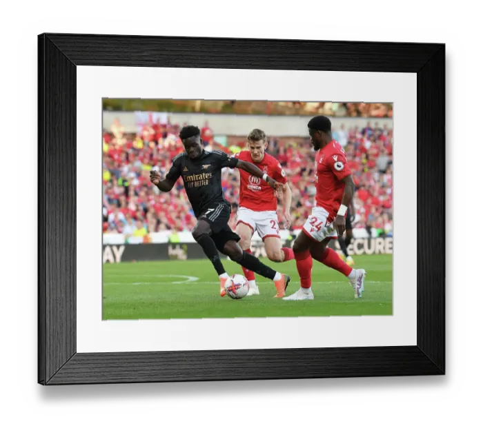 Framed Print : Saka vs Aurier: Battle at the City Ground - Arsenal's Premier League Victory over Nottingham Forest Framed Print : Saka vs Aurier: Battle at the City Ground - Arsenal's Premier League Victory over Nottingham Forest