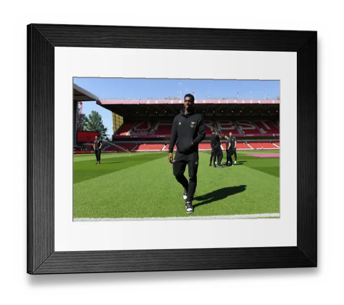 Framed Print : Arsenal's Eddie Nketiah Examines Nottingham Forest's Premier League Pitch Before Showdown (2022-23)