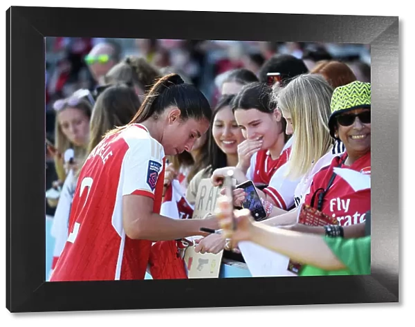 Arsenal Women's Team: Rafaelle Souza Signs Autographs After Arsenal v Aston Villa Match