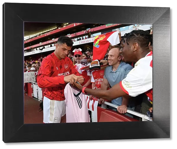 Arsenal's Granit Xhaka Signs Shirt for Fan After Arsenal v Wolverhampton Wanderers Match (2022-23)