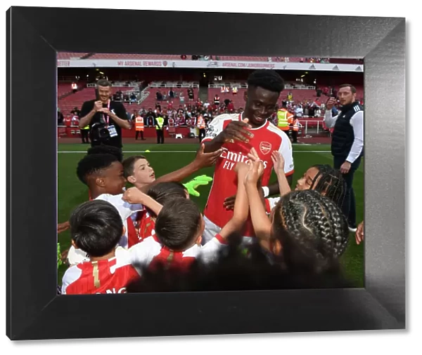 Arsenal's Bukayo Saka Celebrates Victory and Greets Academy Players