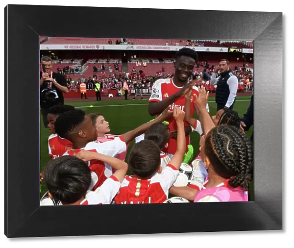Arsenal's Bukayo Saka Greets Academy Players after Arsenal vs. Wolverhampton Wanderers (2022-23)