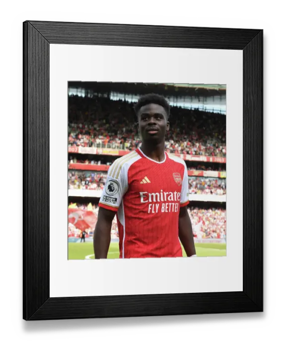 Framed Print : Bukayo Saka: Arsenal's Battle-Ready Star Gears Up for Arsenal vs. Wolverhampton Wanderers, Premier League 2022-23