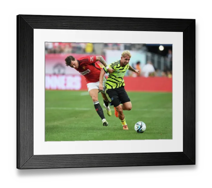 Framed Print : Arsenal's Emile Smith Rowe vs Manchester United's Victor Lindelof: A Pre-Season Face-Off at MetLife Stadium (2023)