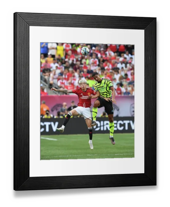 Framed Print : Arsenal vs Manchester United: Saliba and Garnacho Battle for Supremacy in Pre-Season Clash Framed Print : Arsenal vs Manchester United: Saliba and Garnacho Battle for Supremacy in Pre-Season Clash