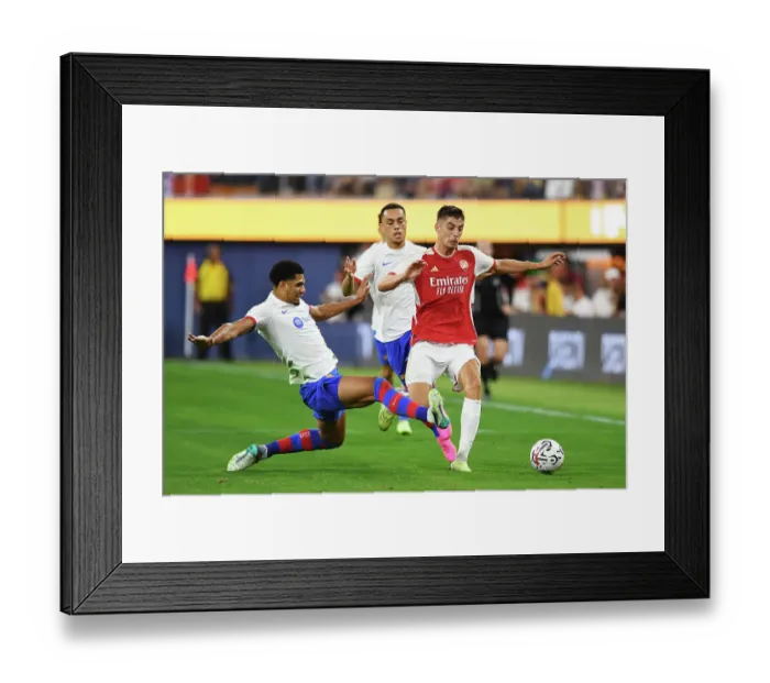 Framed Print : Arsenal vs. FC Barcelona: Pre-Season Clash at SoFi Stadium, 2023 - Kai Havertz Tackled by Ronald Araujo