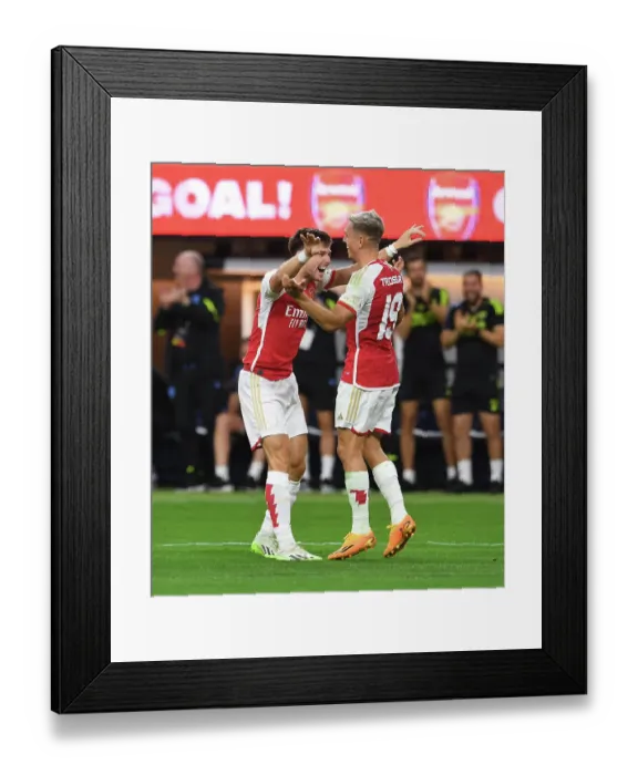 Framed Print : Arsenal's Trossard and Tierney Celebrate Goals Against FC Barcelona in 2023 Pre-Season Friendly
