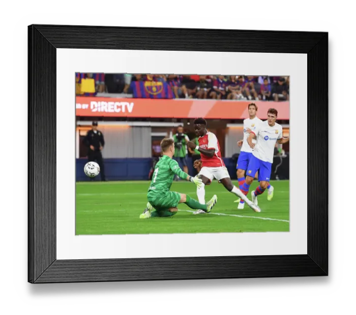 Framed Print : Arsenal Takes the Lead: Bukayo Saka Scores First Goal Against FC Barcelona in 2023 Pre-Season Friendly