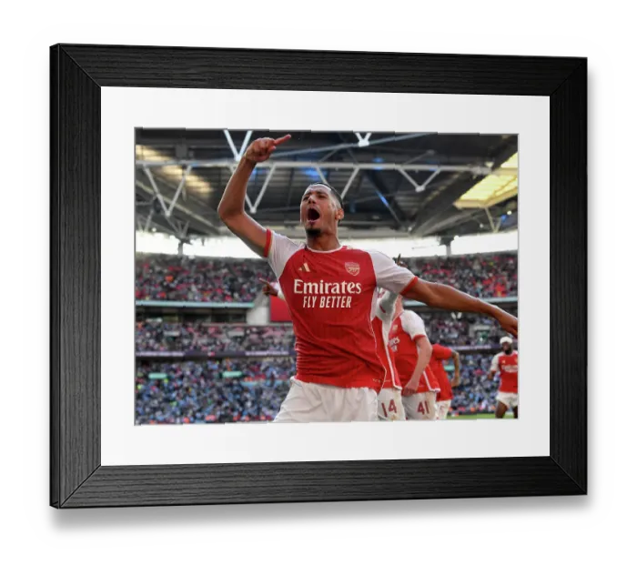 Framed Print : Arsenal's William Saliba Celebrates Community Shield Victory Over Manchester City Framed Print : Arsenal's William Saliba Celebrates Community Shield Victory Over Manchester City