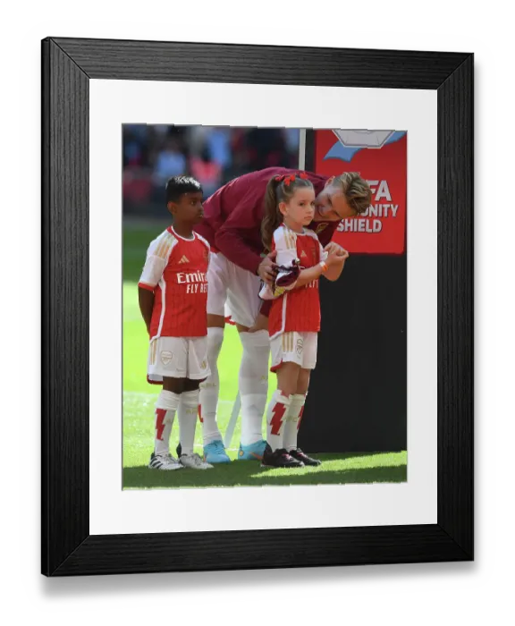Framed Print : Arsenal's Martin Odegaard Chats with Mascots before Arsenal vs Manchester City - FA Community Shield 2023-24 Framed Print : Arsenal's Martin Odegaard Chats with Mascots before Arsenal vs Manchester City - FA Community Shield 2023-24