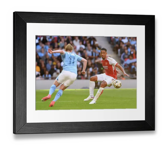 Framed Print : Clash of Titans: Saliba vs De Bruyne - Arsenal vs Manchester City's Epic Community Shield Showdown