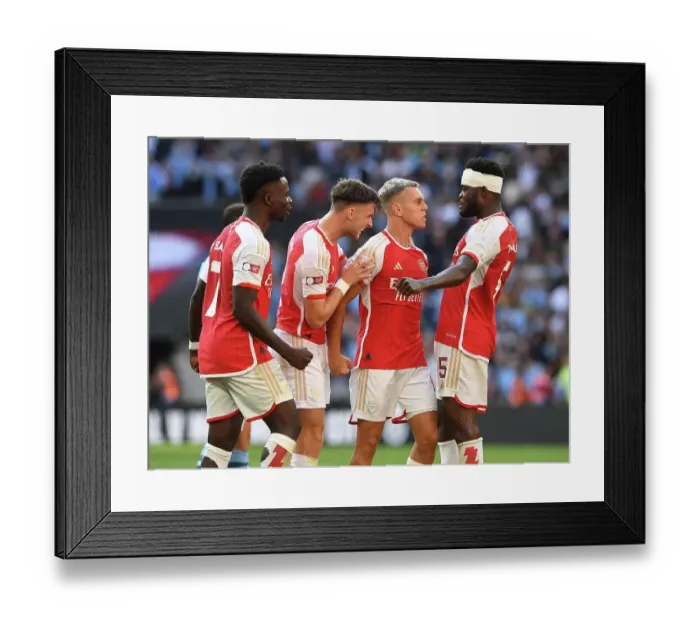 Framed Print : Arsenal's Thrilling Community Shield Victory: Trossard, Saka, Tierney, and Partey Celebrate