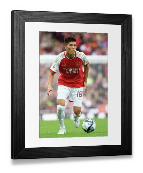 Framed Print : Arsenal's Tomiyasu in Action: Arsenal FC vs AS Monaco, Emirates Cup 2023-24